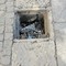 Tombino scoperto e riempito di rifiuti sulla strada verso il Cimitero a Cerignola